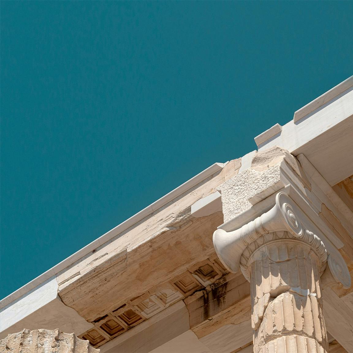 The Parthenon viewed from below with a deep blue sky background 